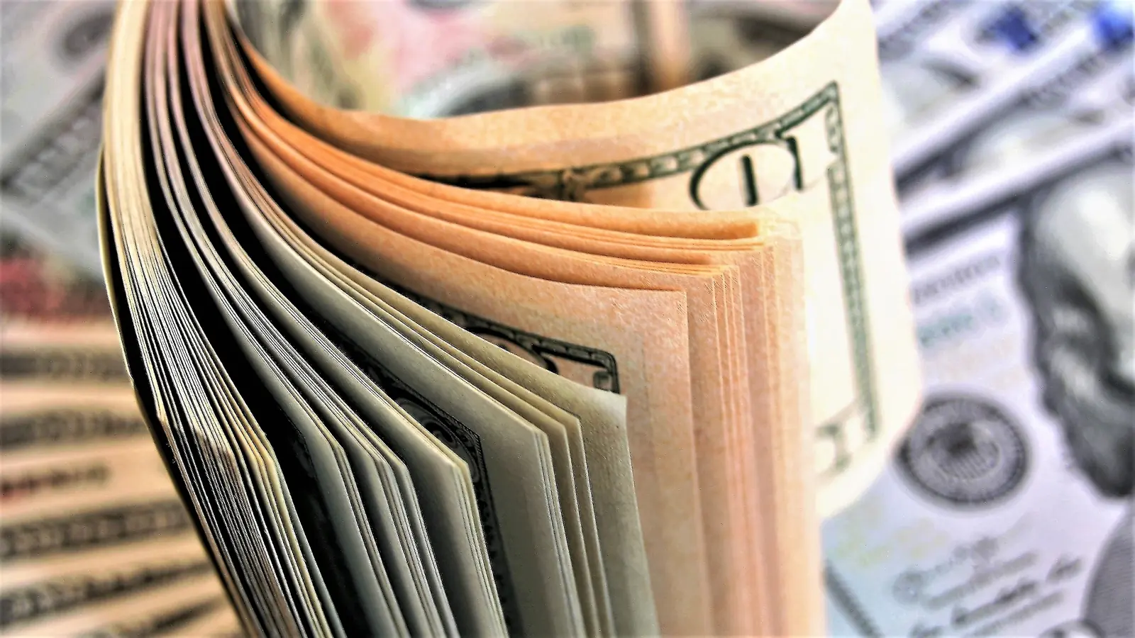 A fanned stack of hundred-dollar bills
